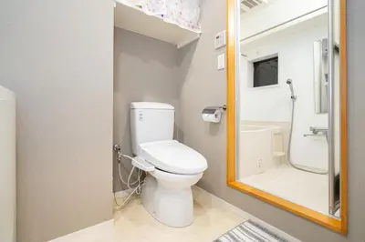 a small bathroom with a toilet and a shower at One Bedroom Family Suite Close Ikebukuro Max 4ppl in Tokyo