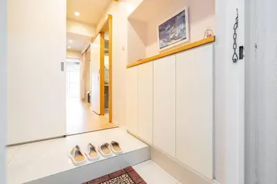 a hallway of a house with a staircase and a mirror at One Bedroom Family Suite Close Ikebukuro Max 4ppl in Tokyo