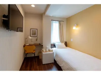 a room with two beds and a desk and a television at ELE HOTEL Higashi Ueno - Vacation STAY 07985v in Tokyo