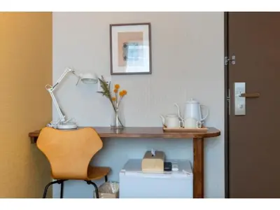 a desk with a chair and a lamp on a table at ELE HOTEL Higashi Ueno - Vacation STAY 08002v in Tokyo