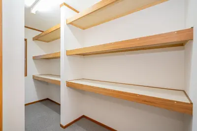 a walk in closet with wooden shelves at ZSF-Minaminagazaki House-TS0317 in Tokyo