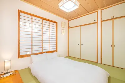 a bedroom with a white bed and a window at ZSF-Minaminagazaki House-TS0317 in Tokyo
