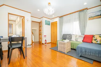 a living room with a couch and a desk at ZSF-Minaminagazaki House-TS0317 in Tokyo
