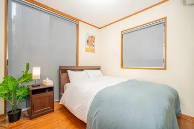 a bedroom with a bed and a large window at ZSF-Minaminagazaki House-TS0317 in Tokyo