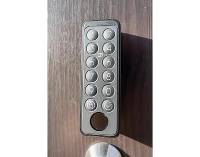 a close up of a door with a remote control at W Hostel in Tokyo