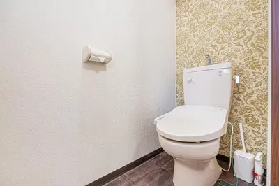 a bathroom with a white toilet in a room at W Hostel in Tokyo