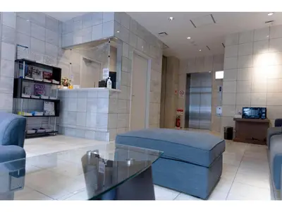 a living room with a couch and a glass table at ELE hotel Ginza East - Vacation STAY 15879v in Tokyo