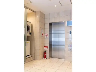 a elevator in a building with a fire hydrant at ELE hotel Ginza East - Vacation STAY 15912v in Tokyo