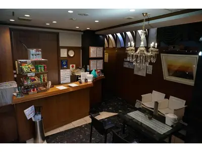 a restaurant with a counter and a table and chairs at Business Hotel Crescent - Vacation STAY 49082v in Tokyo