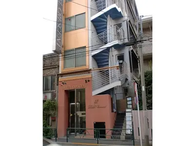 a building with stairs on the side of it at Business Hotel Crescent - Vacation STAY 49938v in Tokyo