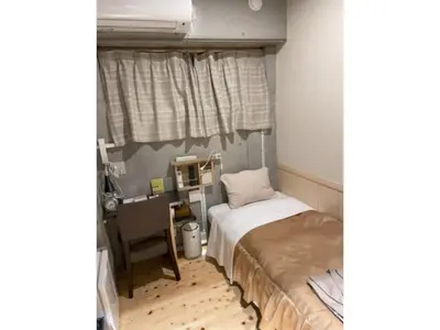 a small bedroom with a bed and a desk at Business Hotel Crescent - Vacation STAY 49965v in Tokyo