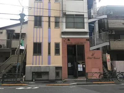 a building with colorful paint on it on a city street at Business Hotel Crescent - Vacation STAY 49965v in Tokyo