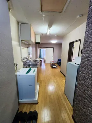 an empty room with a kitchen with a refrigerator at Mamada Building - Vacation STAY 17009 in Tokyo