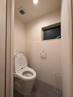 a bathroom with a toilet with the lid up at \u30db\u30c6\u30eb\u9685\u7530\u5ddd in Tokyo