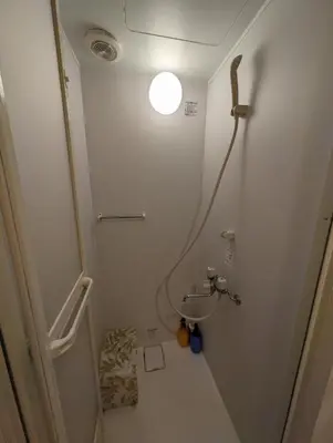 a small bathroom with a sink and a light at \u30db\u30c6\u30eb\u9685\u7530\u5ddd in Tokyo
