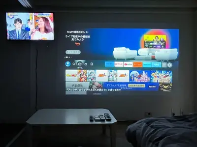 a flat screen tv hanging on a wall at Shinjuku 3 min walk from stationp #projector OH33 in Tokyo