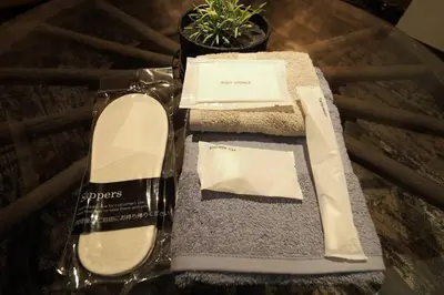 a glass table with a box of cosmetics and a plant at Shinjuku 3 min walk from stationp #projector OH33 in Tokyo
