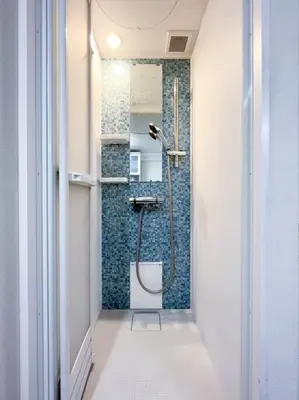 a bathroom with a shower with a toilet in it at Shinjuku 3 min walk from stationp #projector OH33 in Tokyo