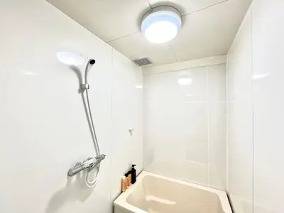 a white bathroom with a shower and a sink at JUN \u6b4c\u821e\u4f0e\u753a10Floor-SJ0098 in Tokyo