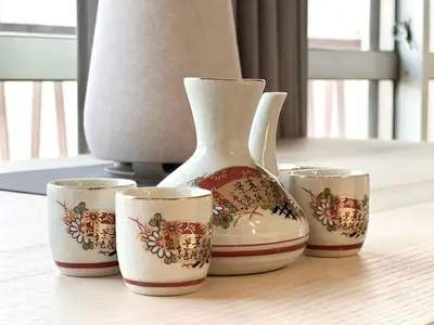 a vase and three cups sitting on a table at JUN \u6b4c\u821e\u4f0e\u753a10Floor-SJ0098 in Tokyo