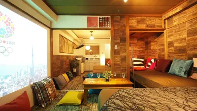 a room with a bed and a couch and a table at Shinjuku 3 min walk from station projector #OH5 in Tokyo