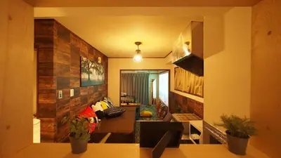 a view of a living room with a couch at Shinjuku 3 min walk from station projector #OH5 in Tokyo