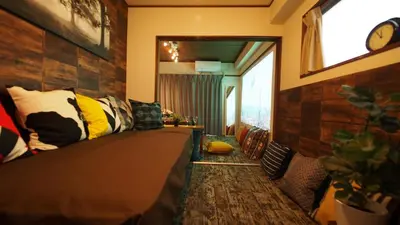 a bedroom with a bed and a window at Shinjuku 3 min walk from station projector #OH5 in Tokyo