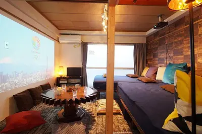 a bedroom with a bed and a table in a room at Shinjuku 3 min walk from station #projector OH2-3 in Tokyo
