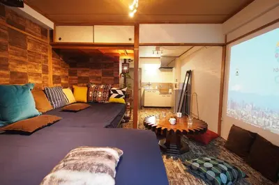 a living room with a couch and a table at Shinjuku 3 min walk from station #projector OH2-3 in Tokyo