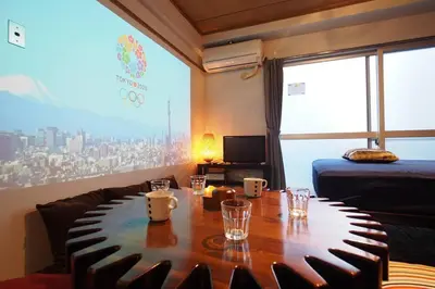 a room with a table with chairs and a large window at Shinjuku 3 min walk from station #projector OH2-3 in Tokyo