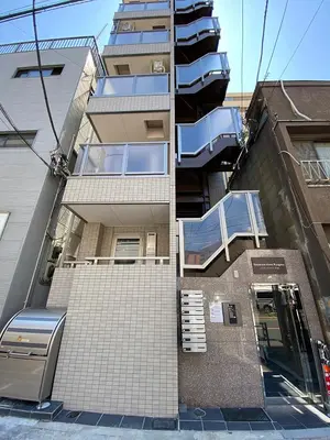 a tall building with a balcony on the side of it at Residence Hotel Ryogoku in Tokyo