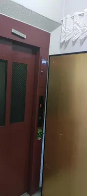 a door in a building with a sign on it at \u30ef\u30f3\u30d5\u30ed\u30a2\u8cb8\u5207 in Tokyo