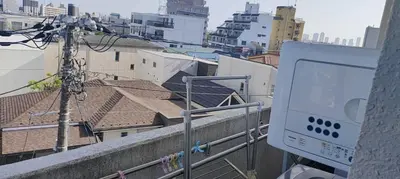 a view of a city from a balcony at \u30ef\u30f3\u30d5\u30ed\u30a2\u8cb8\u5207 in Tokyo