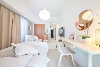a hospital room with two beds and a desk at Shinjuku Kabukicho Designer's Apartment VI in Tokyo