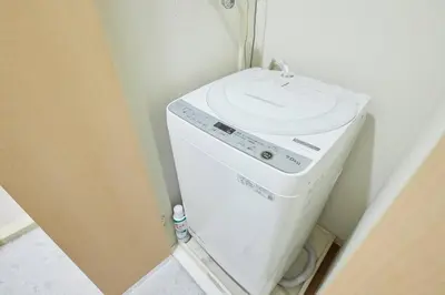 a washing machine with a sink on top of it at Shinjuku Kabukicho Designer's Apartment VII in Tokyo