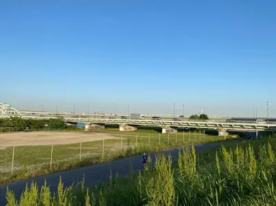 a bridge over a river with a bridge in the background at Very near Skytree Asakusa Newly build apartment 102 in Tokyo