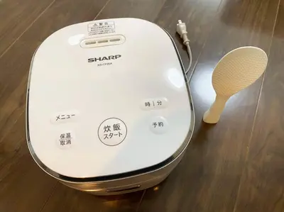a white toaster sitting on top of a wooden floor at Very near Skytree Asakusa Newly build apartment 102 in Tokyo