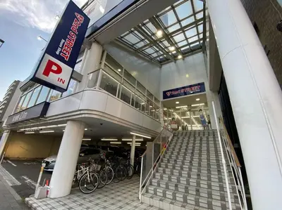 a parking garage with bikes parked outside of a building at Very near Skytree Asakusa Newly build apartment 102 in Tokyo