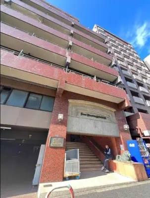 a building with stairs and a person standing in front of it at 12 MIN walk to Shinjuku STR ,6 MIN Higashishinjuku ,nearest kabukicho ,shinjuku oen, in Tokyo