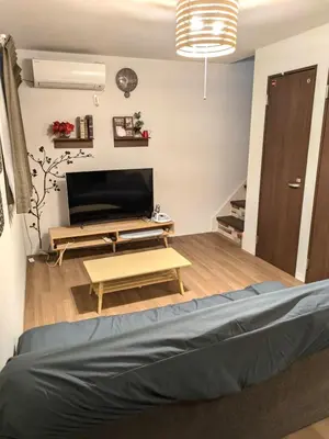 a living room with a bed and a couch at 9, Minamisuna 2, Entire house for rent, \u5357\u78022 in Tokyo