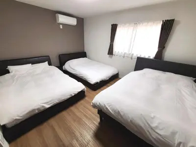 a room with two beds and a window at 9, Minamisuna 2, Entire house for rent, \u5357\u78022 in Tokyo