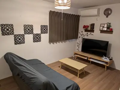a living room with a couch and a tv at 9, Minamisuna 2, Entire house for rent, \u5357\u78022 in Tokyo