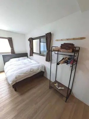 a small bedroom with a bed and a shelf at 9, Minamisuna 2, Entire house for rent, \u5357\u78022 in Tokyo