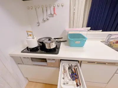 a kitchen counter with a stove and a sink at JINGHOUSE Takasago detached house - Vacation STAY 17050 in Tokyo