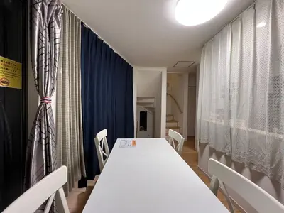 a conference room with a long table and chairs at JINGHOUSE Takasago detached house - Vacation STAY 17050 in Tokyo