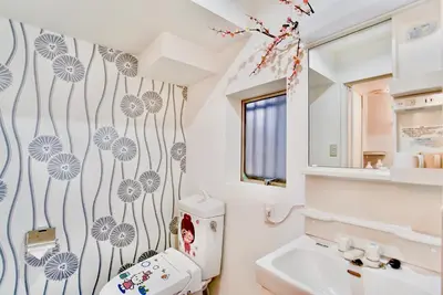 a bathroom with a toilet and a sink at \u8c4a\u5cf6\u6c11\u5bbf206 in Tokyo