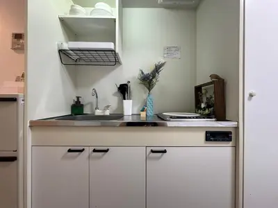 a kitchen with a sink and a counter top at nestay inn tokyo waseda in Tokyo