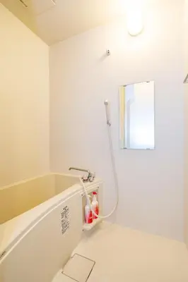 a bathroom with a bath tub with a shower at 5, Kikukawa, Entire house for rent, \u83ca\u5ddd in Tokyo