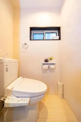 a bathroom with a white toilet and a window at 5, Kikukawa, Entire house for rent, \u83ca\u5ddd in Tokyo