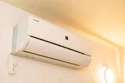 a white microwave oven hanging from a ceiling at 5, Kikukawa, Entire house for rent, \u83ca\u5ddd in Tokyo